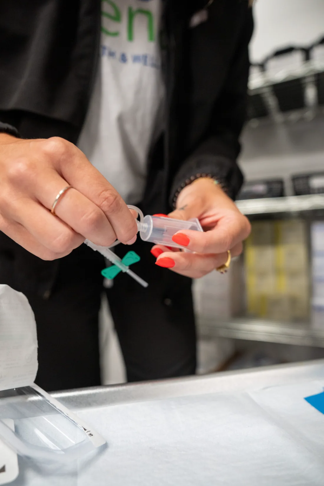 Juvenate team member preparing supplies for an in-house blood draw