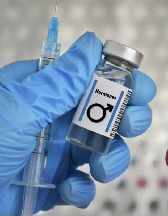 Provider holding a men’s hormone vial
